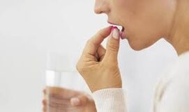 The girl takes pill